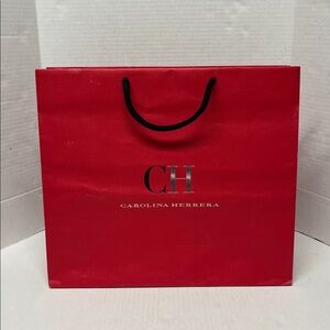 Carolina herrera empty red cardboard shopping bag gift bag designer packaging